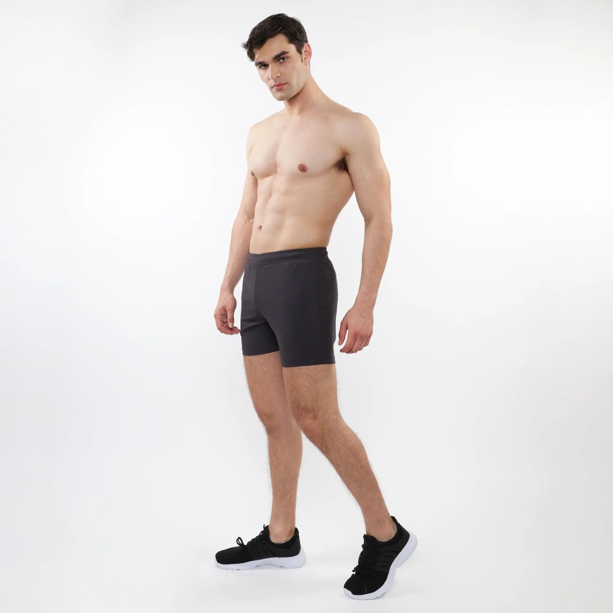 Black textured mesh stretch performance shorts with a sleek form-fitting design for athletic use