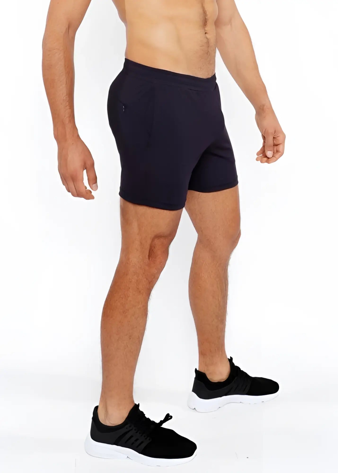 Black textured mesh stretch performance shorts with a sleek form fitting design and subtle side pockets