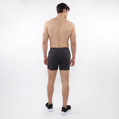 Black textured mesh stretch performance shorts with sleek form fitting design and subtle side pockets