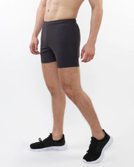 Black textured mesh stretch performance shorts with snug elastic waistband and smooth form-fitting fabric