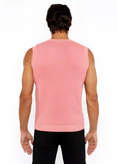 A pink ribbed knit sleeveless top with a crew neckline in a textured open knit vest design