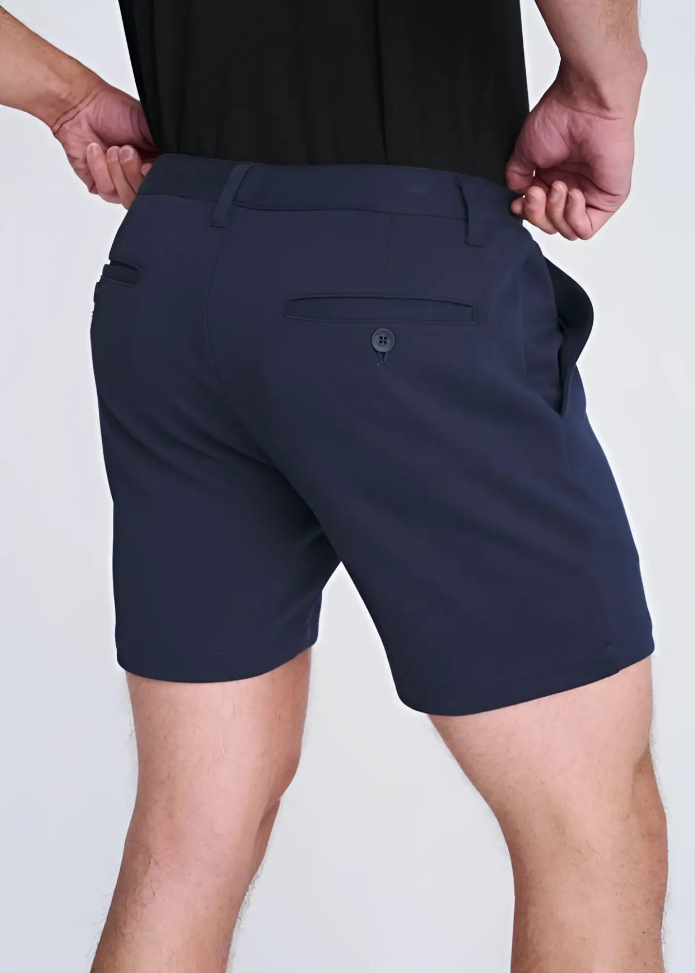 Dark navy blue textured stretch knit chino shorts with sleek tailored fit and subtle button detail on back pocket view