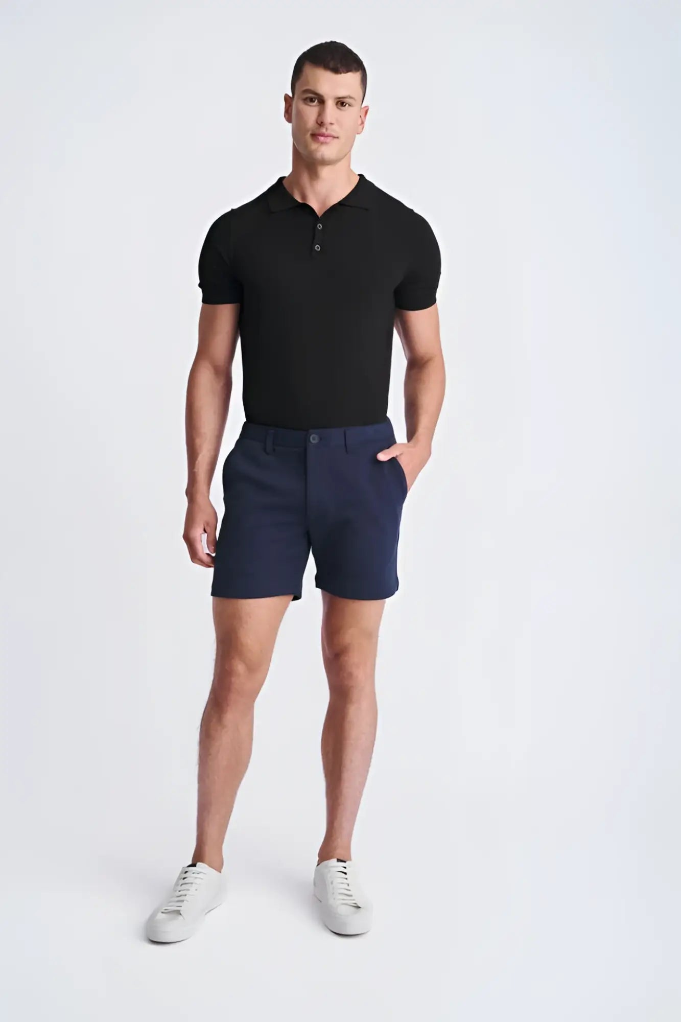 Navy blue textured stretch knit chino shorts with classic fit and button closure for casual wear