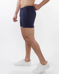 Navy blue textured stretch knit chino shorts for men with a sleek tailored fit and subtle zip side pockets
