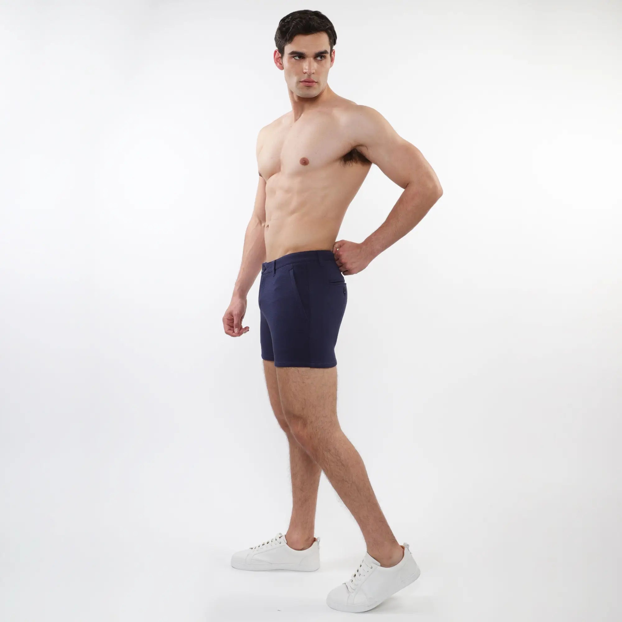 Navy blue men’s briefs with tailored fit and clean design featured alongside textured stretch knit chino shorts with zip pockets