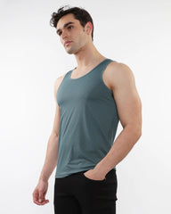 A sleek teal textured stretch mesh performance tank with smooth form-fitting sleeveless design