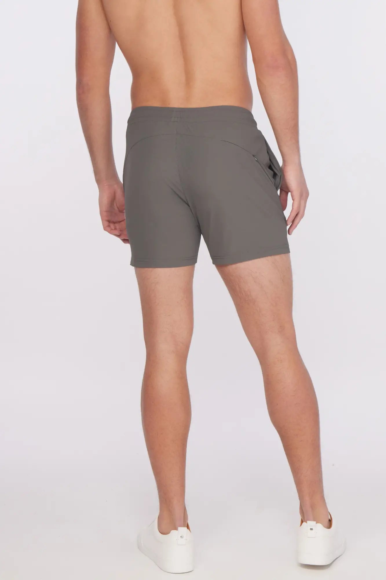 Gray textured stretch performance athletic shorts with sleek modern design and subtle side pockets for active use