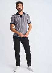 A man wearing a navy and gray textured stripes silk tencel polo with dark blue collar and sleeve cuffs