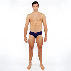 Navy blue textured swim brief with front buckle and metallic silver logo on waistband for men