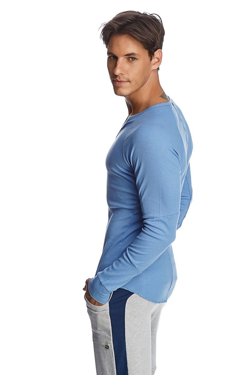A light blue thermal long sleeve ribbed knit shirt with a rounded neckline and v-neck style perfect for layering