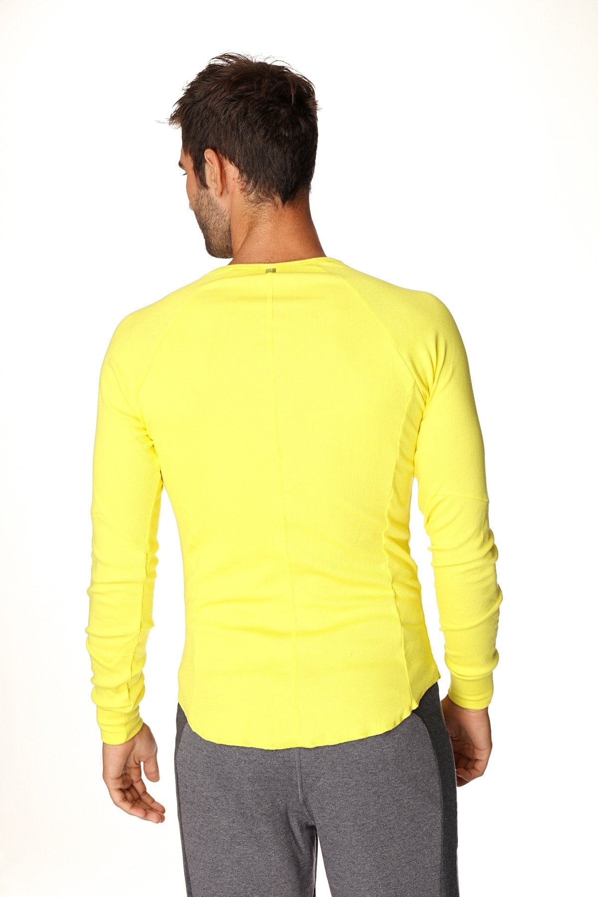 Bright yellow thermal v-neck long sleeve shirt with fitted cut and ribbed cuffs for athletic use