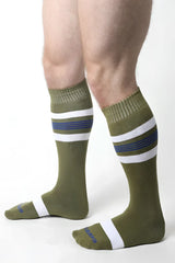 Olive green tight end knee high socks with white and navy stripes ribbed cuff and toe for athletic use