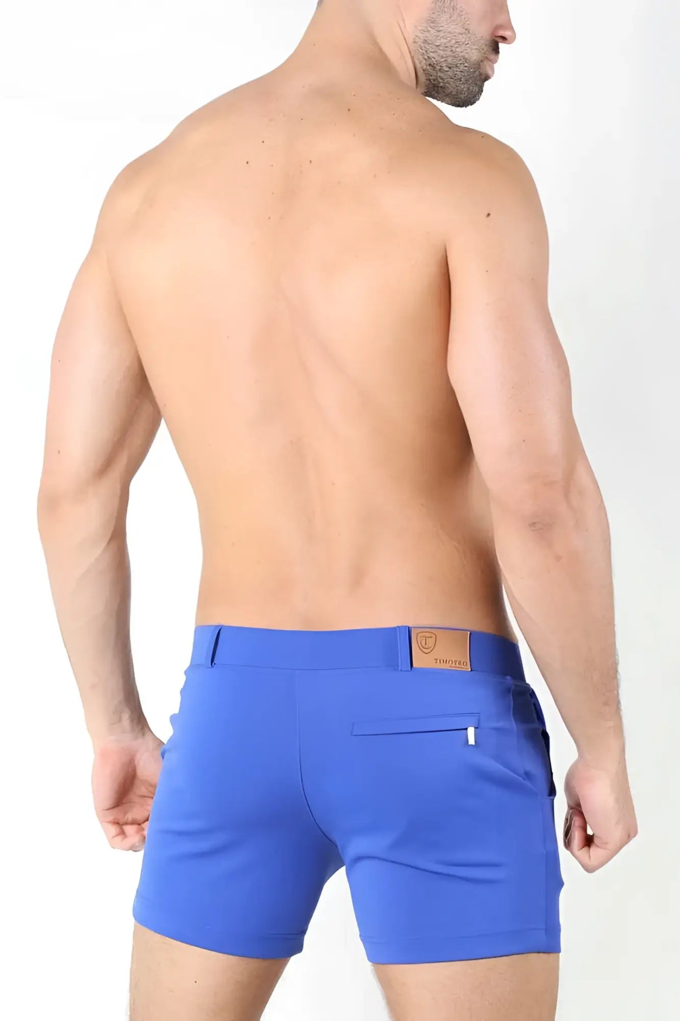 Bright blue form-fitting Timoteo Santa Monica shorts with brown leather patch on waistband size m back view