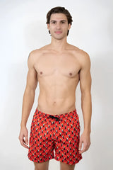 Red toucan print swim shorts with black and yellow abstract pattern perfect for swimming and beachwear