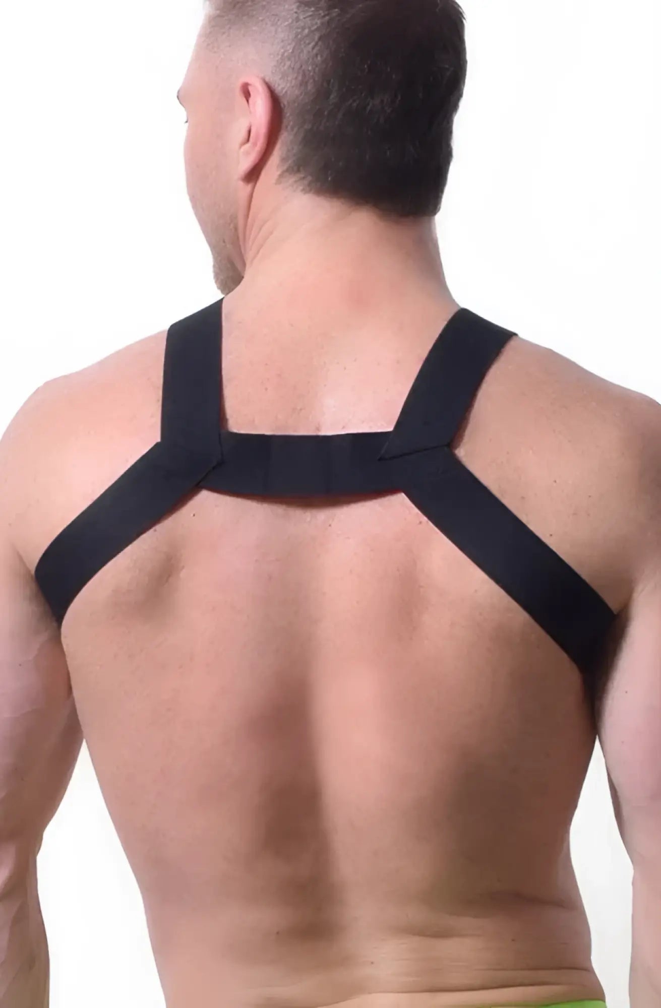 Black elastic strap transistor harness worn across the back showing adjustable fit and sleek design