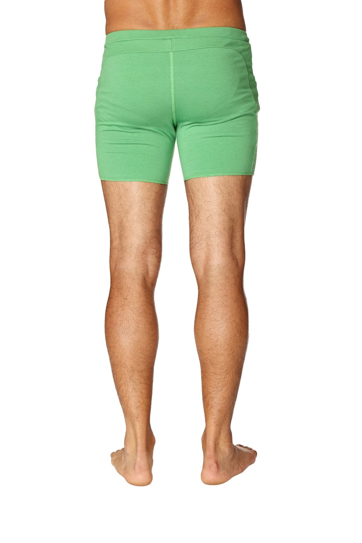 Transition yoga short in bamboo green featuring snug fit green athletic shorts with elastic waistband