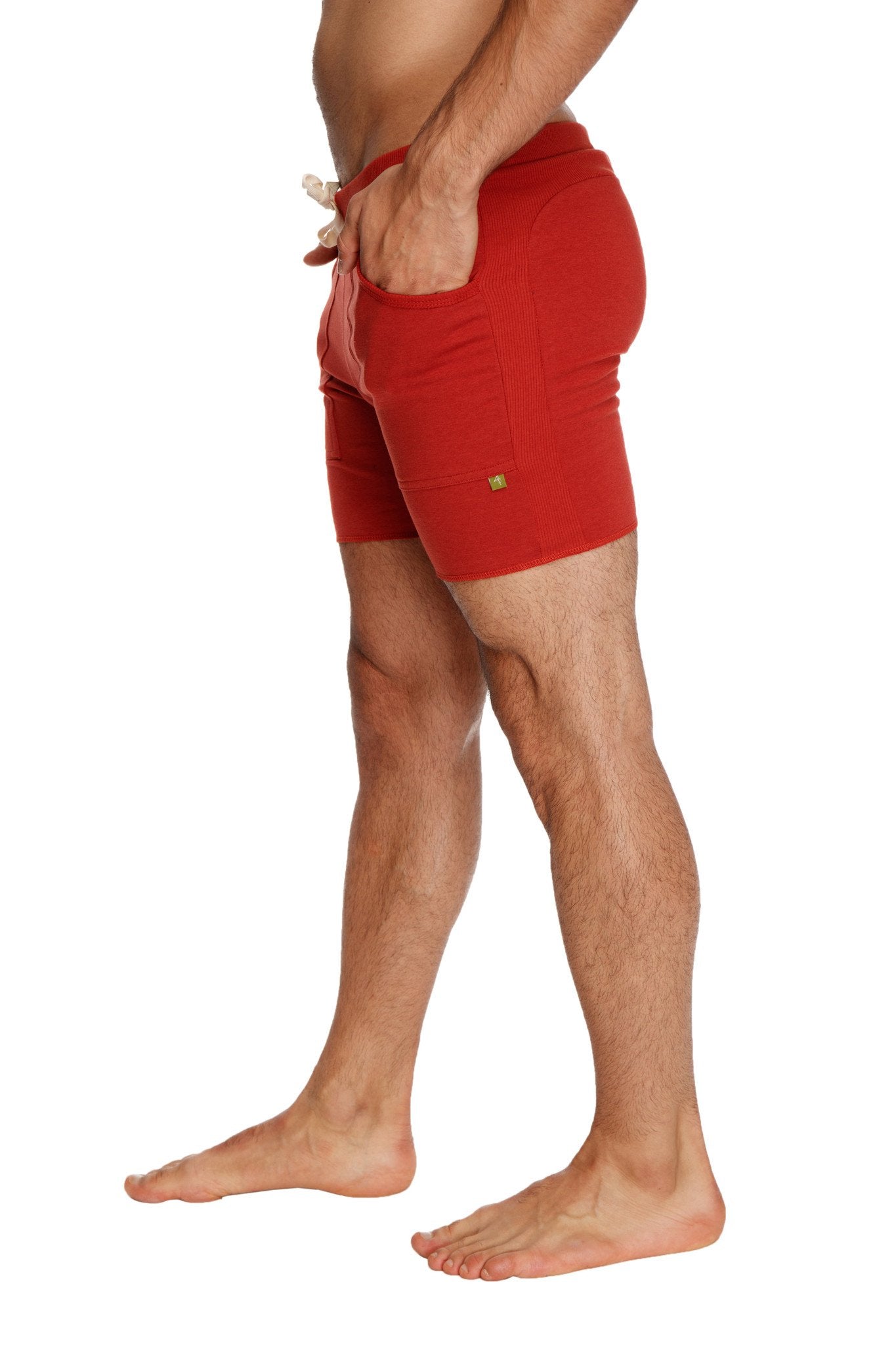 Red athletic transition yoga shorts with drawstring waist and side pockets in cinnabar red for active wear