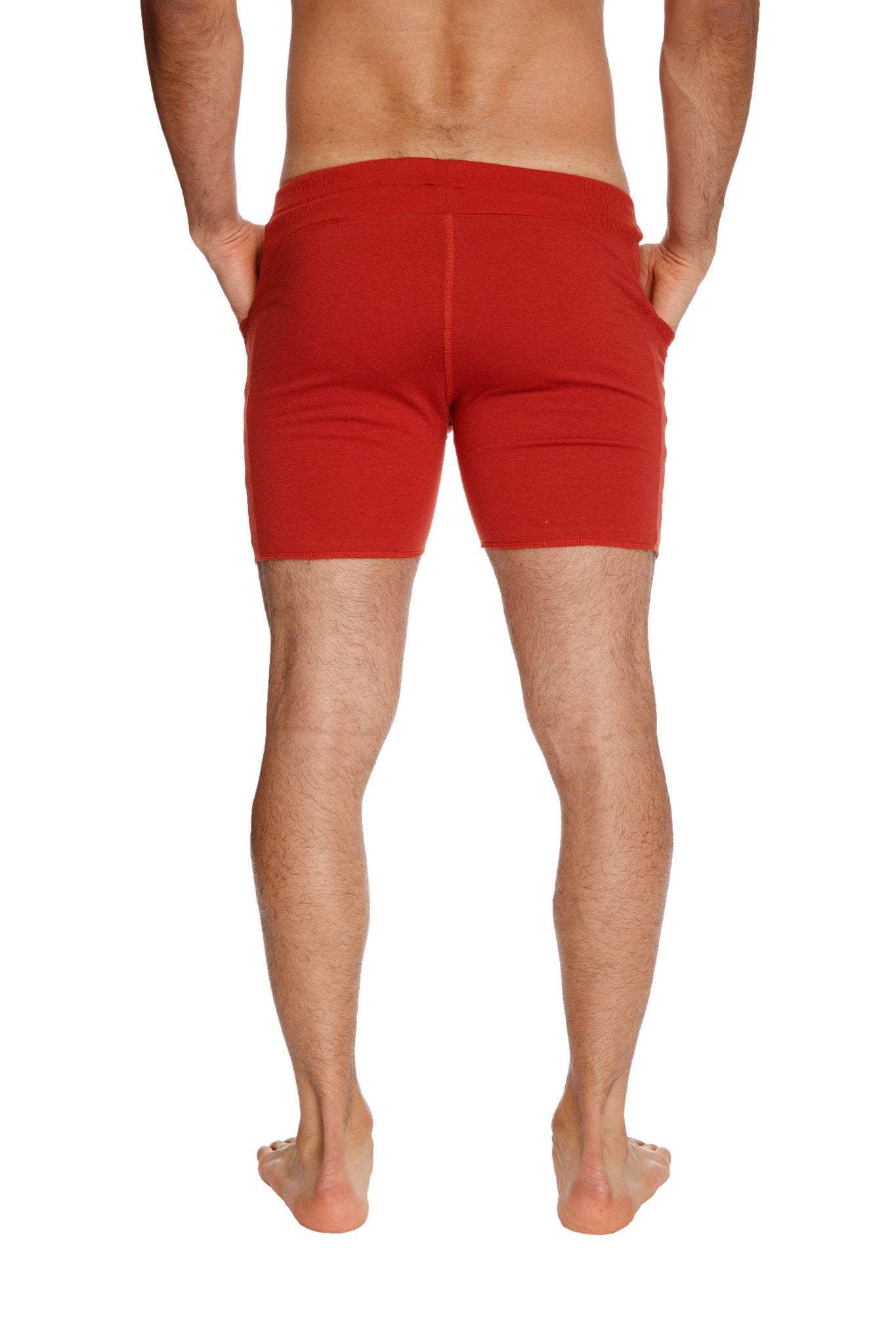 Transition yoga short in cinnabar red with snug fit and side pockets designed for athletic performance