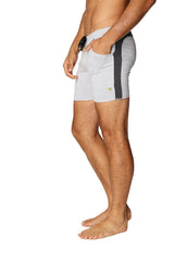Transition yoga short in grey with charcoal black side stripe and green logo designed for athletic use