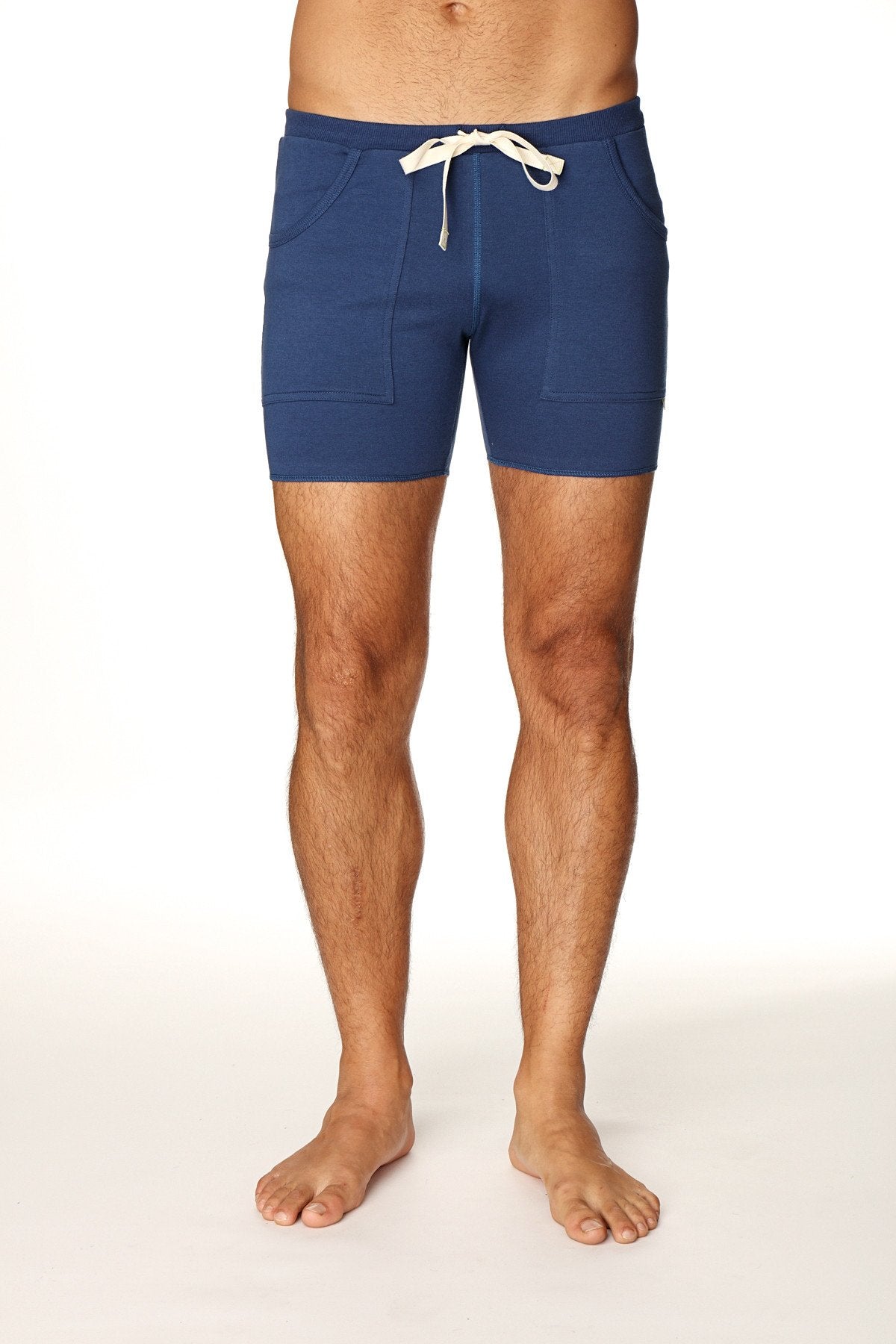 Navy blue transition yoga short with white drawstring and front pockets designed for athletic use