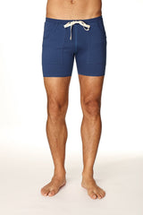 Navy blue transition yoga short with white drawstring and front pockets designed for athletic use