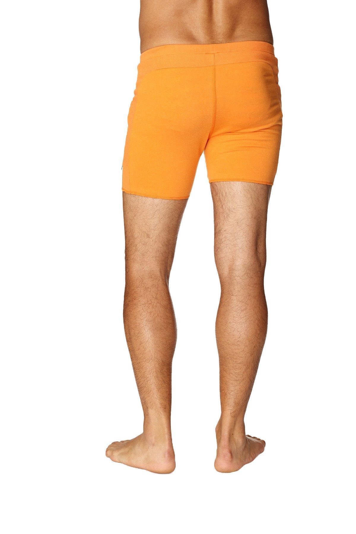 Transition yoga short in sun orange with snug fit and elastic waistband designed for athletic use