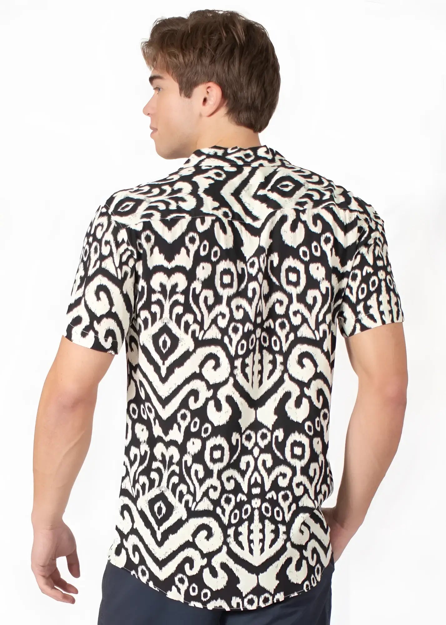 Black and white short-sleeved button-up tribal abstract s s shirt with intricate ikat pattern perfect for casual wear