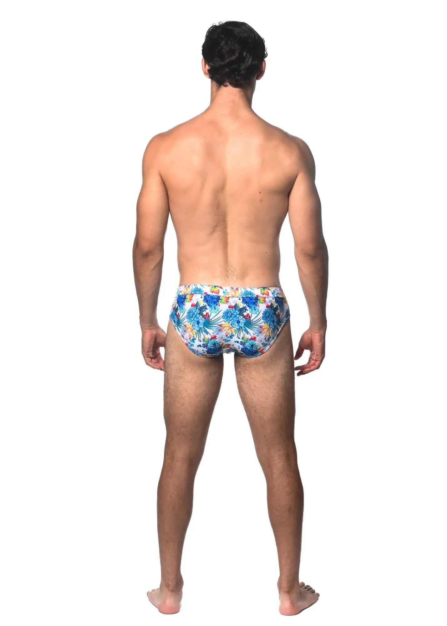 Tropics printed swim brief featuring blue and yellow floral pattern swim trunks for beach and pool use