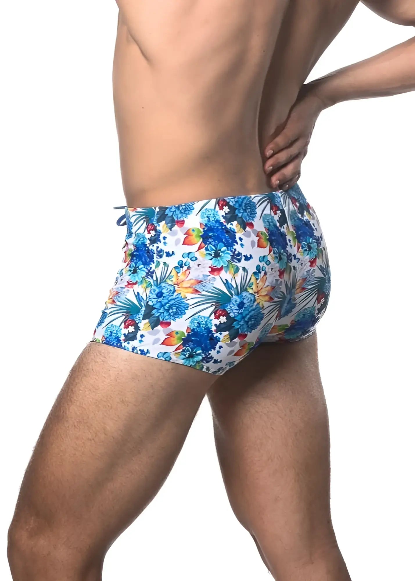 Tropics printed swim trunk with blue and multicolored tropical floral pattern designed for beachwear
