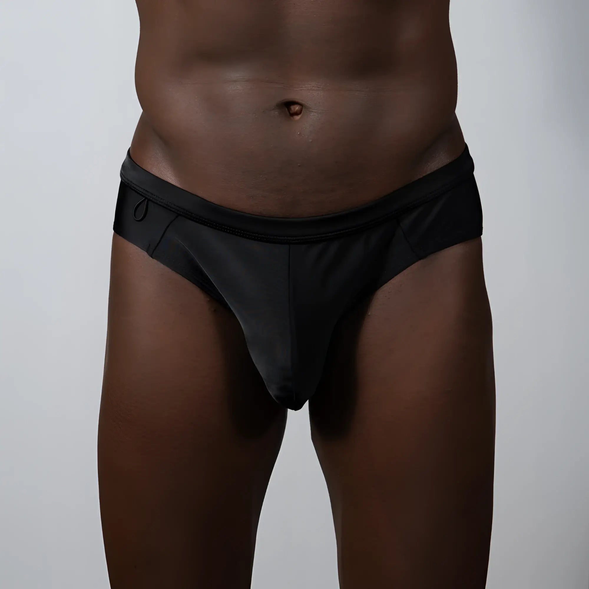 Black sleek form-fitting TULIO bikini brief with smooth fabric finish for comfortable swimwear use