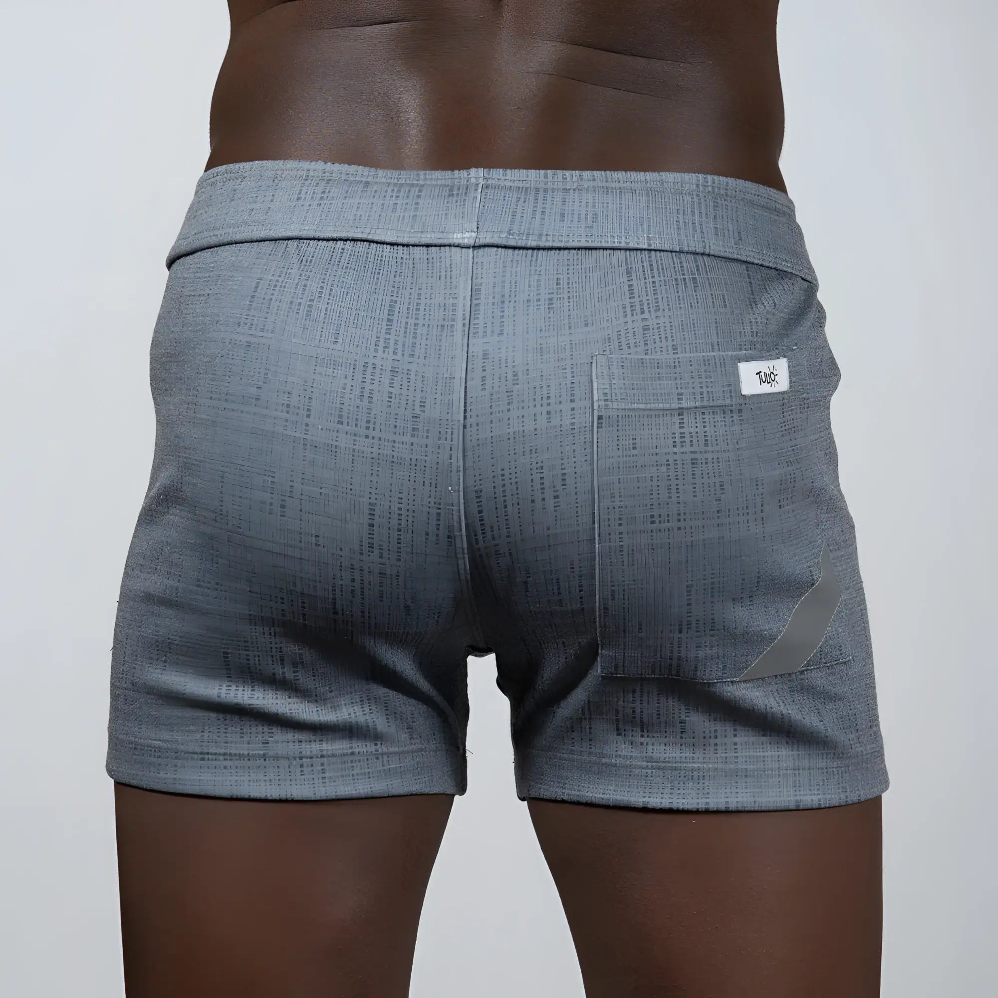Gray tulio linen texture shorts with subtle woven pattern and small white brand tag on the back pocket shown from behind