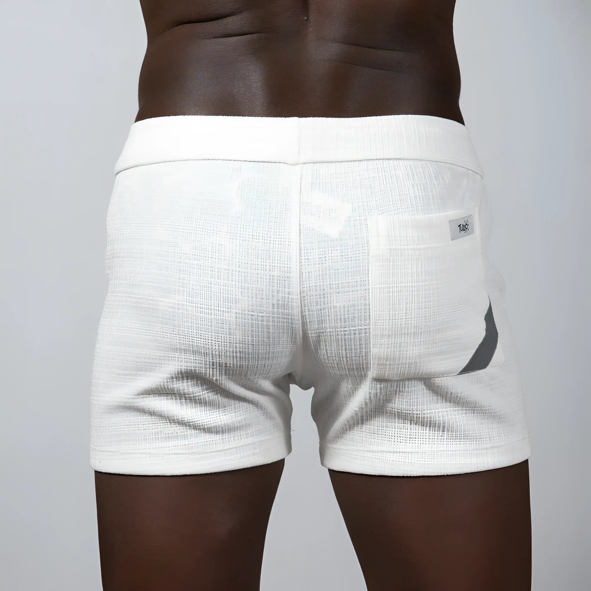 White textured linen shorts with subtle gray accent on side pocket from tulio linen texture shorts assorted colors