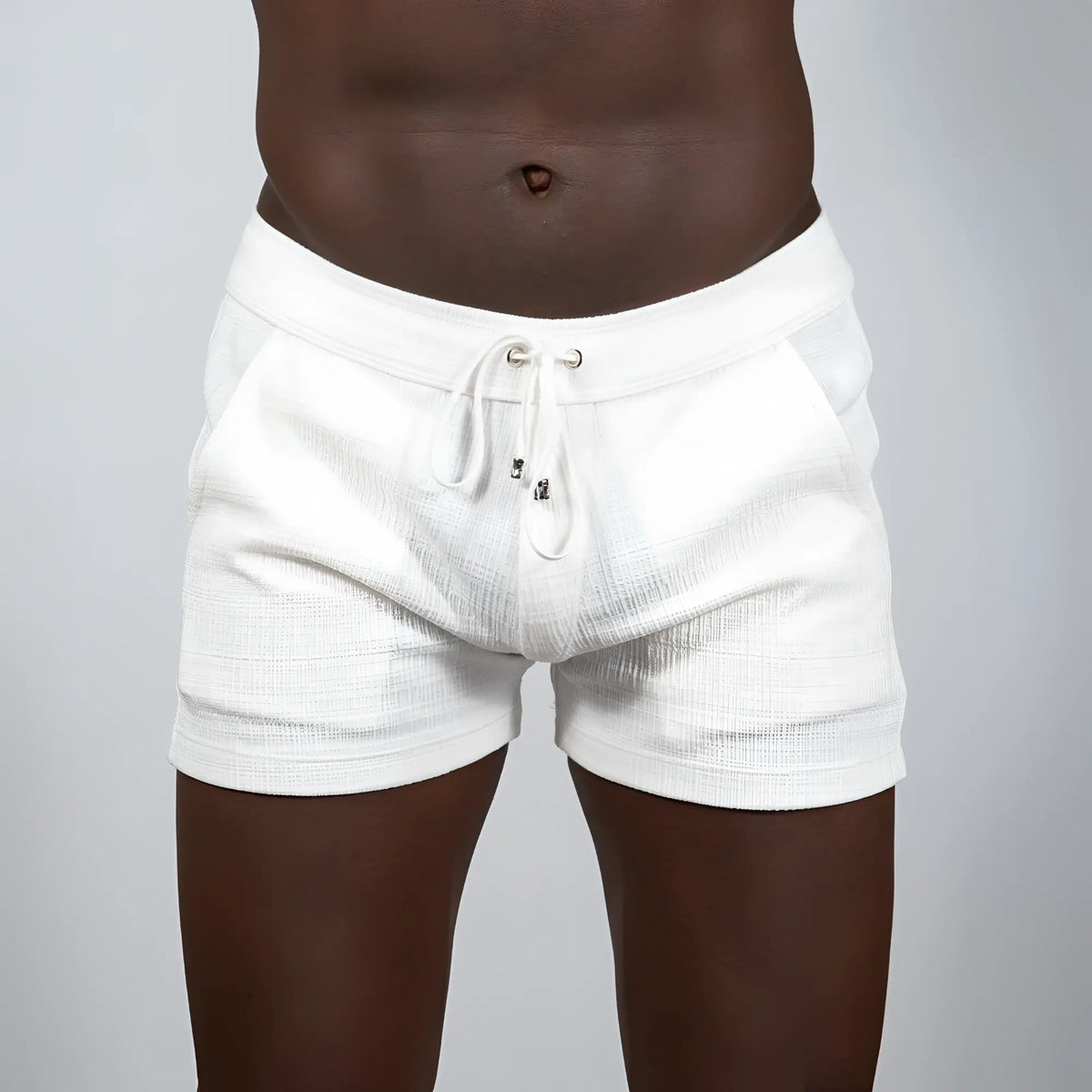 White tulio linen texture shorts with drawstring waistband and subtle horizontal ribbing in assorted colors