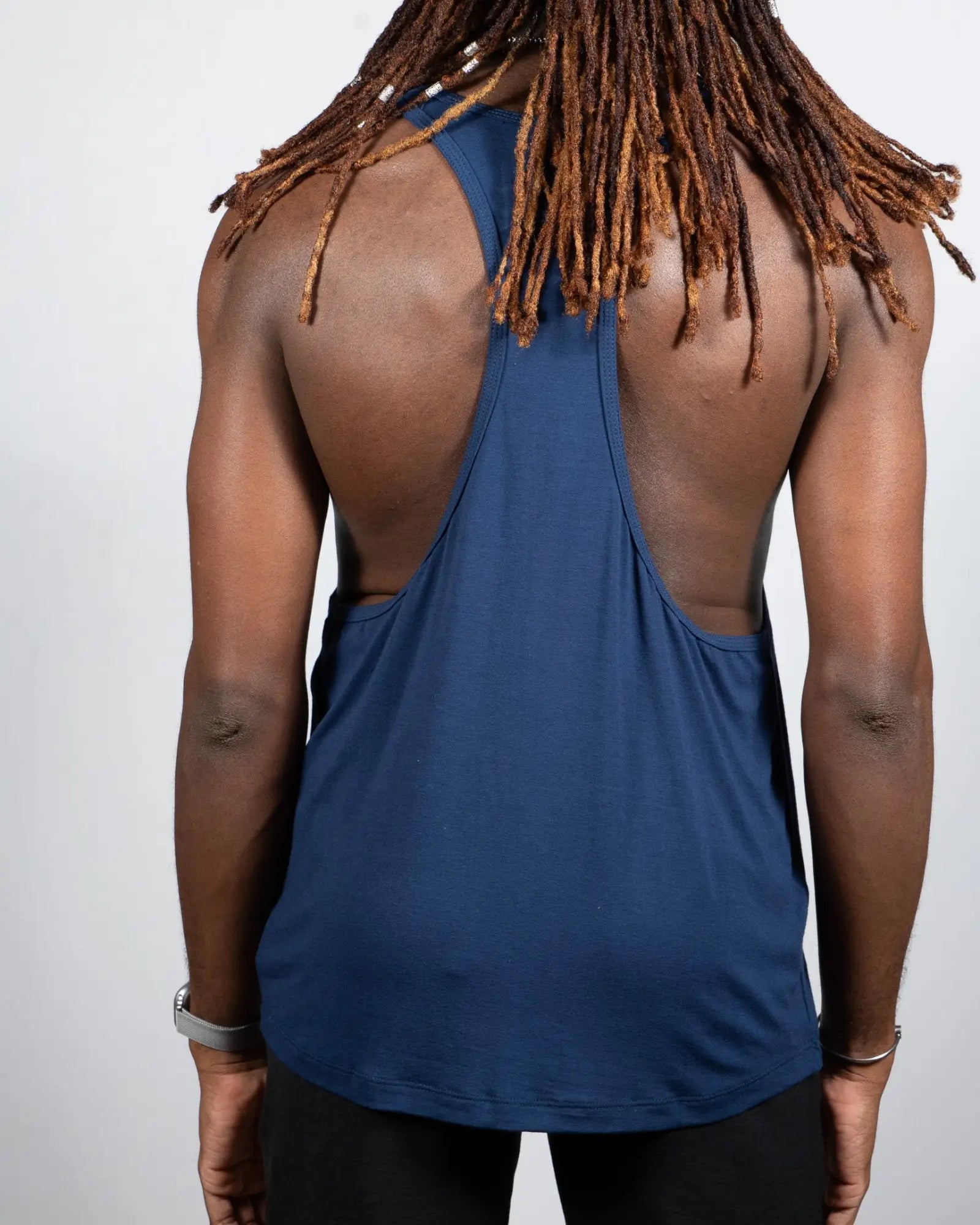 A navy blue tulio racerback tank top with a cutout back design available in four colors