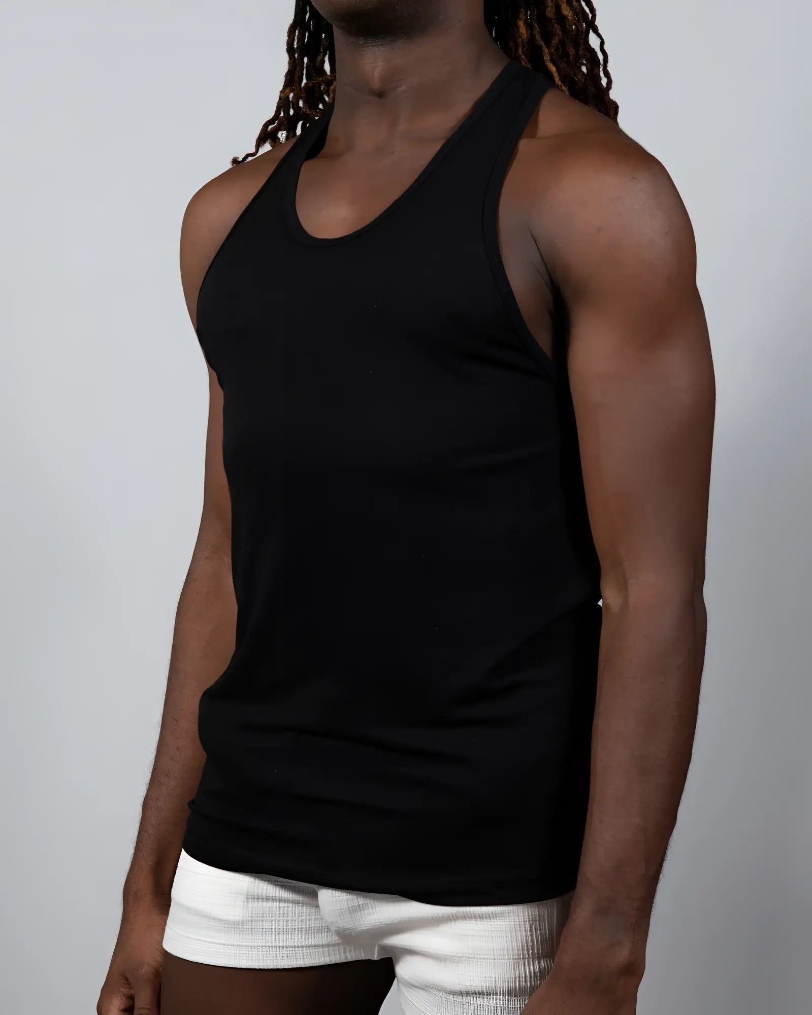 Black tulio solid tank racerback tank top with smooth fitted silhouette for activewear and casual use