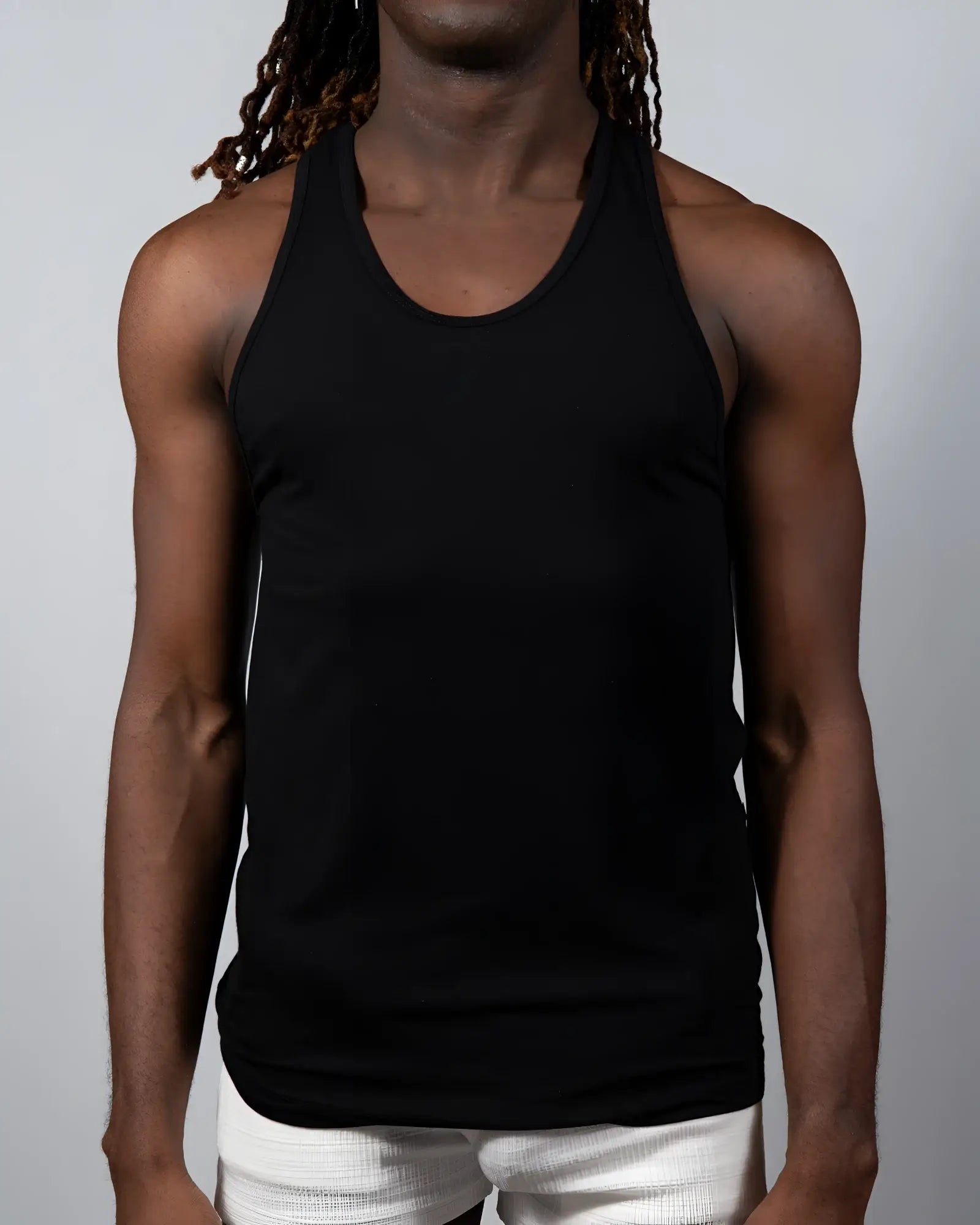 Black sleeveless tulio solid tank top with rounded neckline and fitted silhouette ideal for casual wear