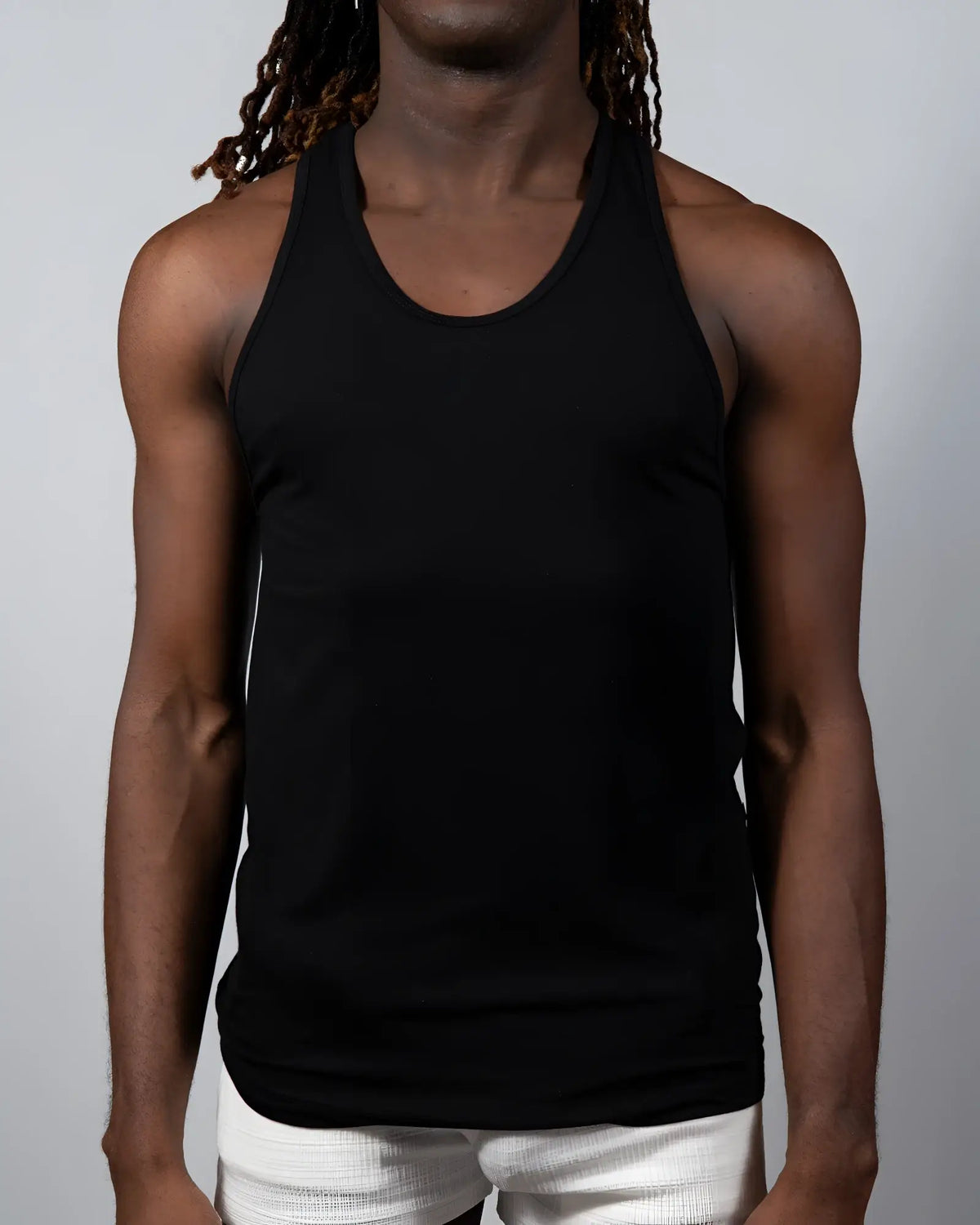 Black sleeveless tulio solid tank top with rounded neckline and fitted silhouette ideal for casual wear