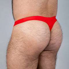 Bright red tulio swim thong made of smooth stretchy fabric perfect for swimwear and beachwear