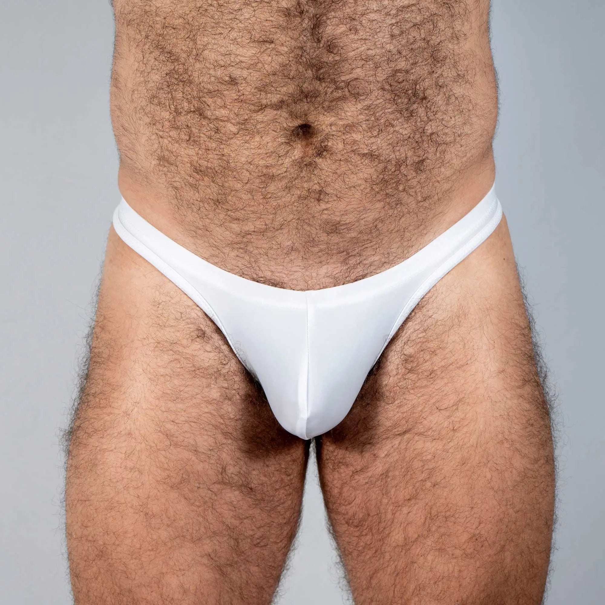 White tulio swim thong solids with a smooth form-fitting design made of comfortable swim fabric shown from the front