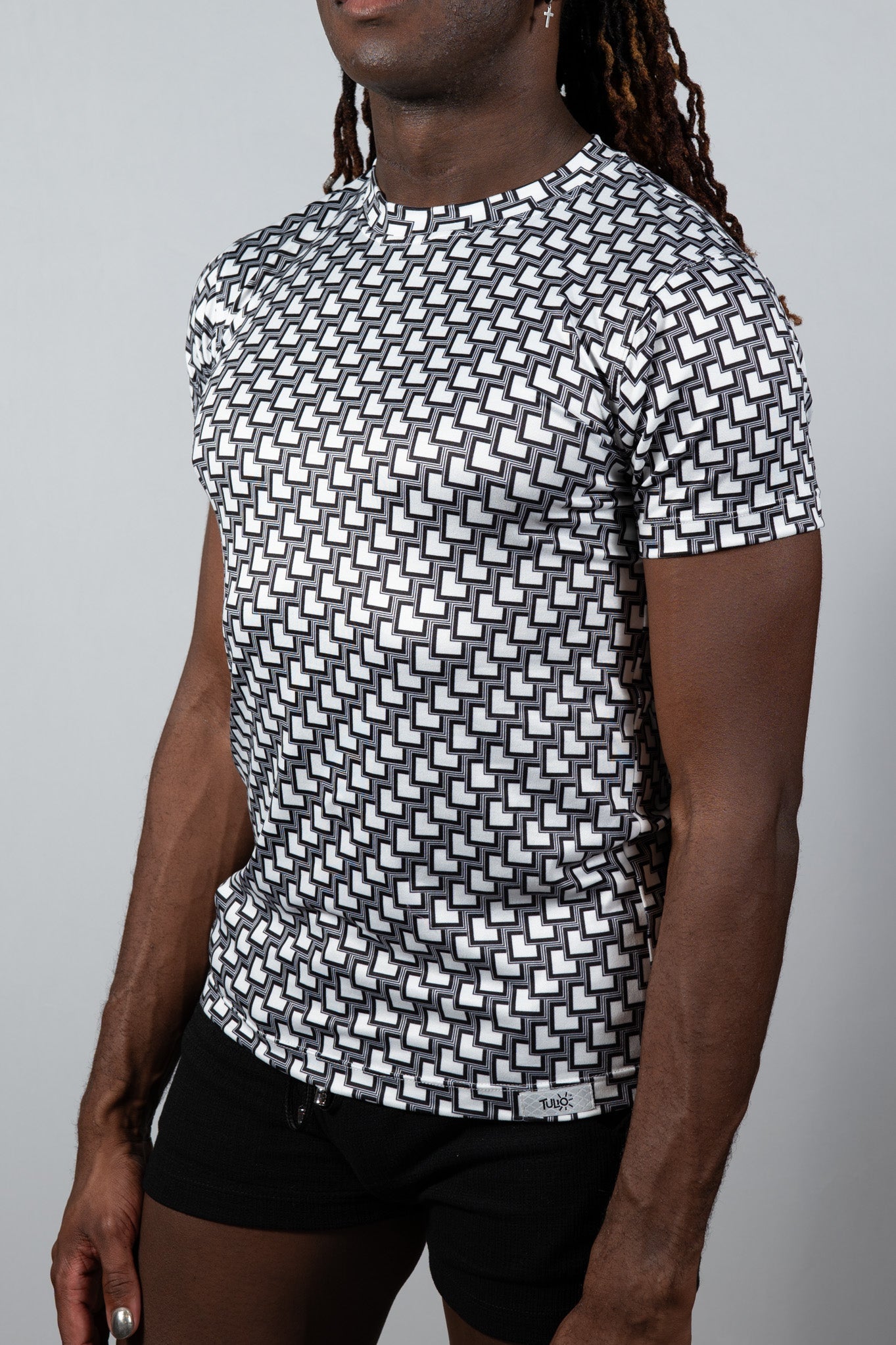 Black and white geometric patterned short-sleeve crew neck tile print tee made from soft breathable fabric