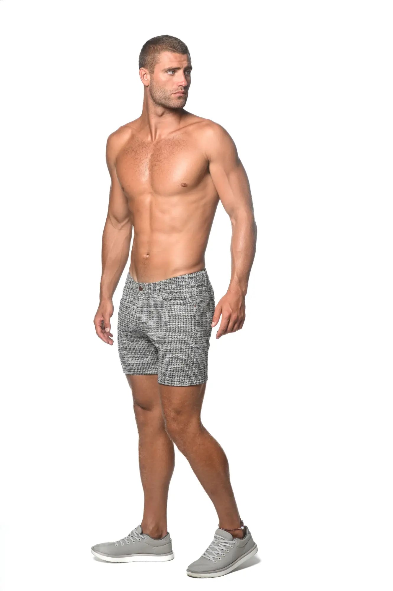 Gray tweed-look jacquard stretch knit jeans shorts with subtle herringbone pattern and textured fabric