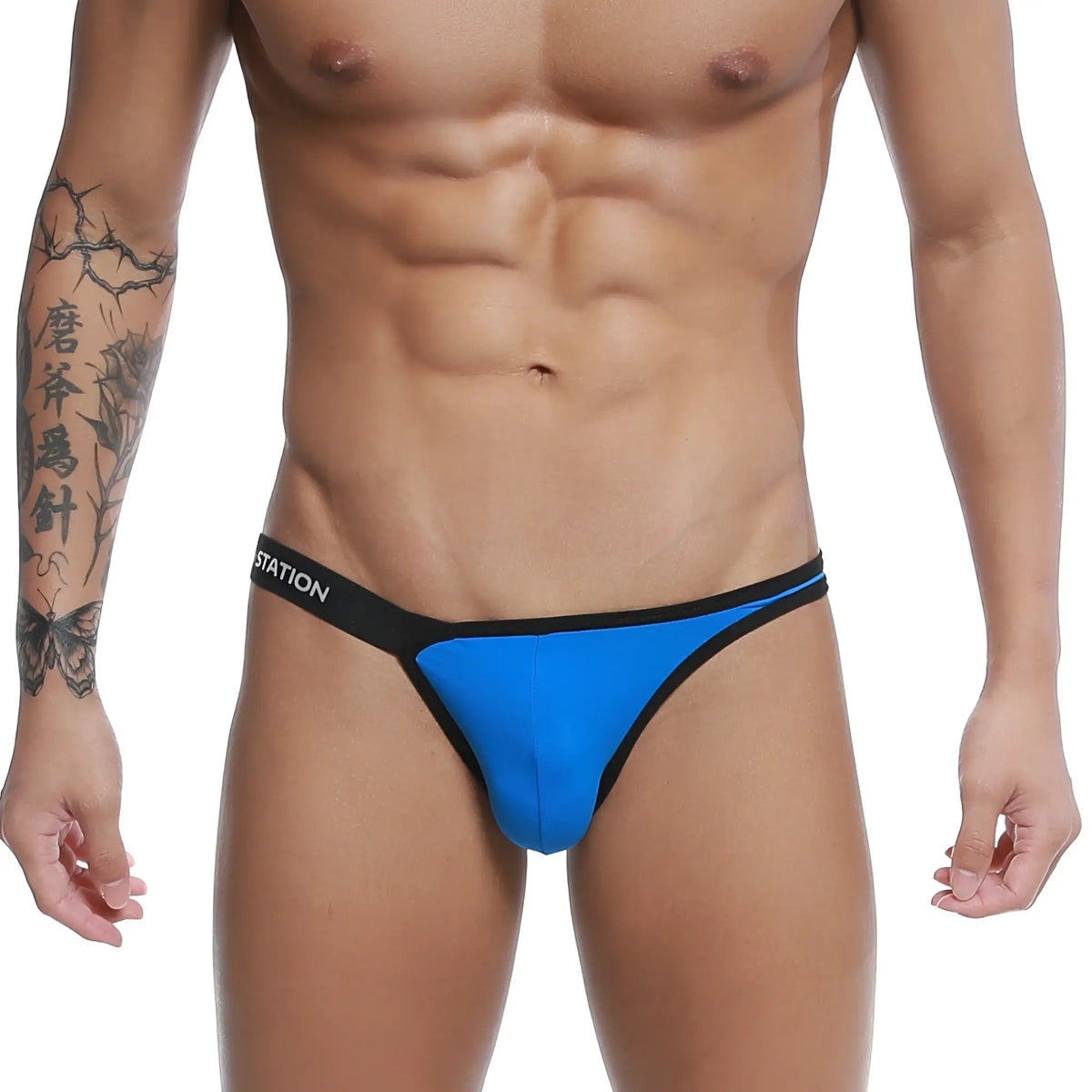 Bright blue thong bikini with black trim and station logo on waistband u-station calypso bikini royal u0012-432
