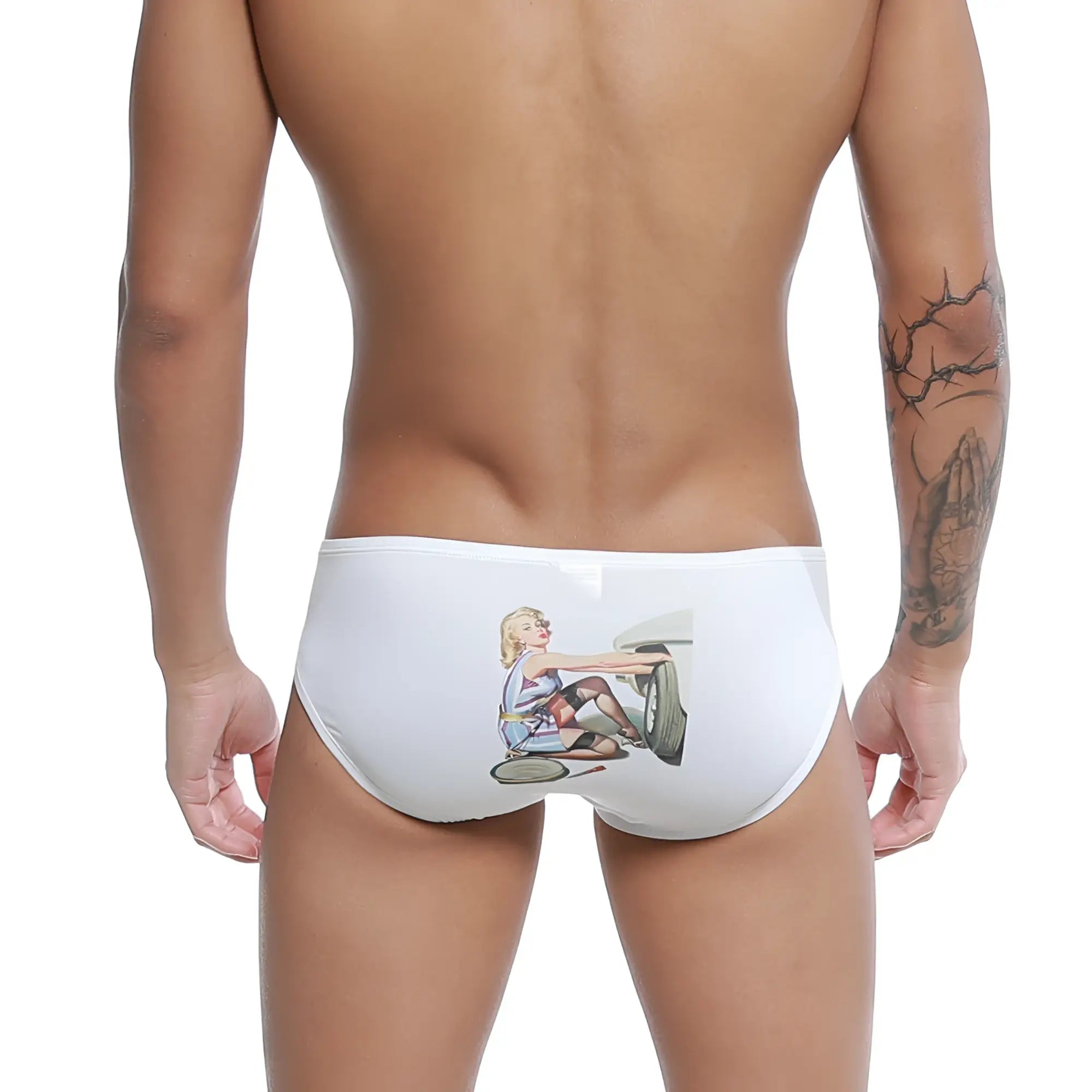 White swim trunks featuring a vintage illustration of a blonde woman in a retro racing outfit on a classic car wheel