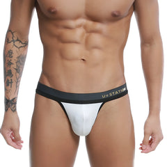 White u station talent thong with black waistband showing front side in breathable fabric for comfortable wear