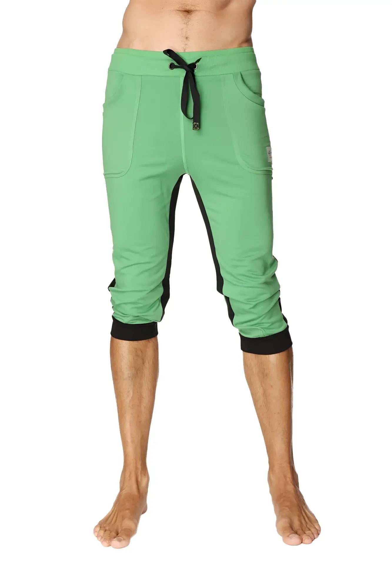 Green capri-length ultra-flex tri-color cuffed yoga pant with black side panels and elastic cuffs