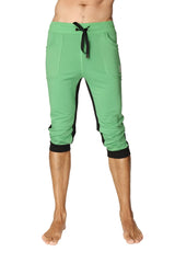 Green capri-length ultra-flex tri-color cuffed yoga pant with black side panels and elastic cuffs