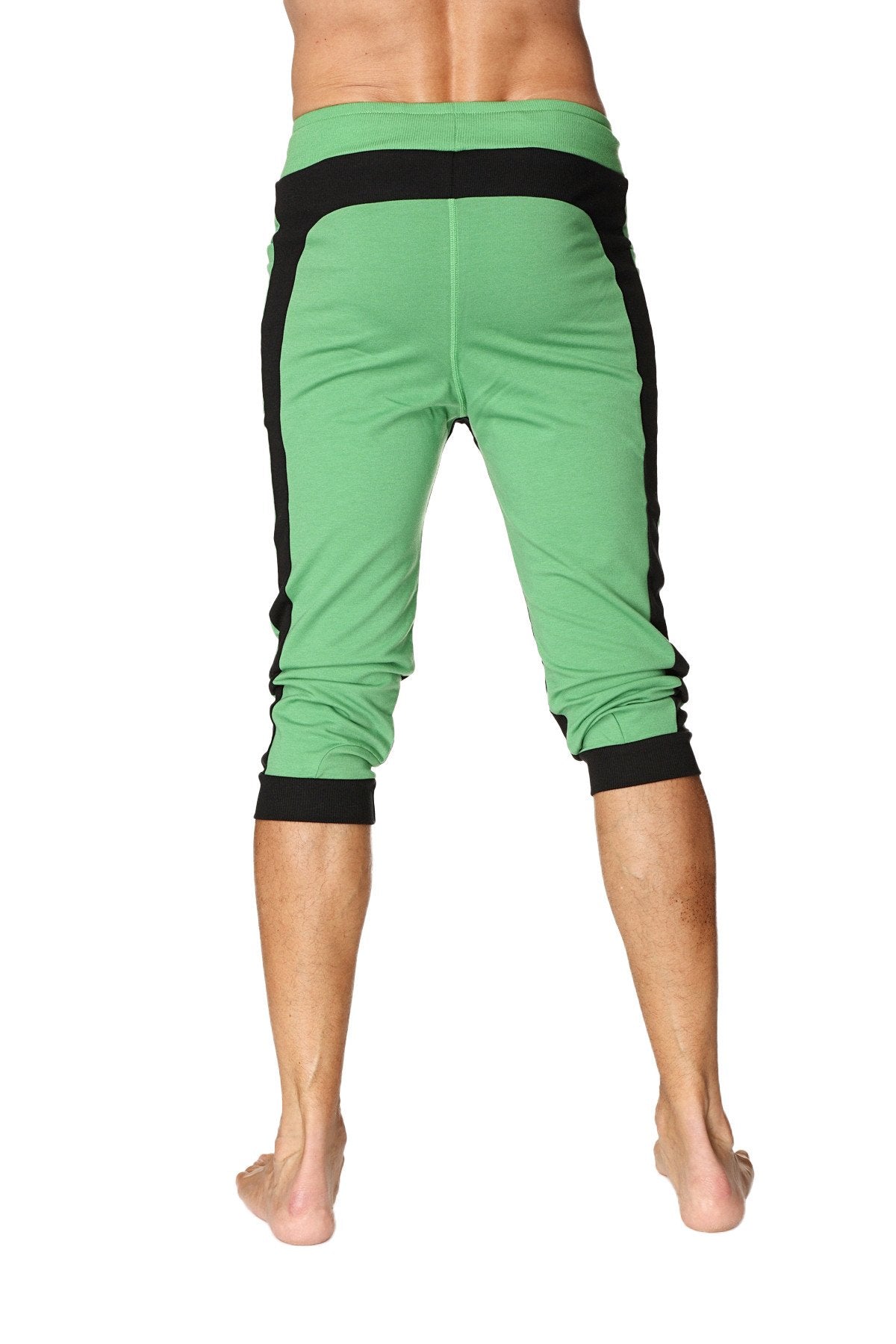Green ultra-flex tri-color cuffed yoga pants with black side panels and elastic cuffs for flexible comfort