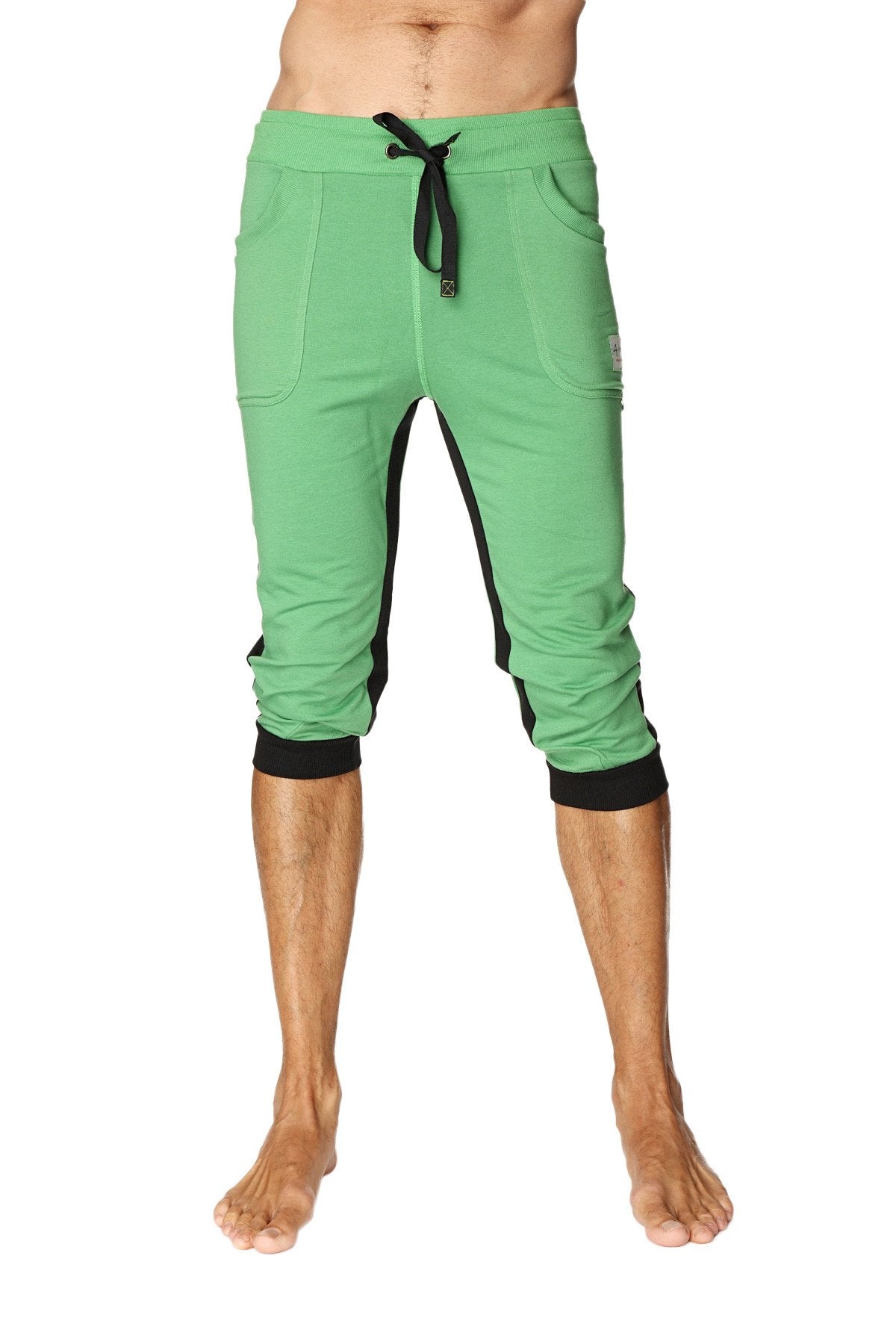 Green capri-length ultra-flex tri-color cuffed yoga pant with black side panels and elastic cuffs