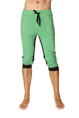 Green capri-length ultra-flex tri-color cuffed yoga pant with black side panels and elastic cuffs