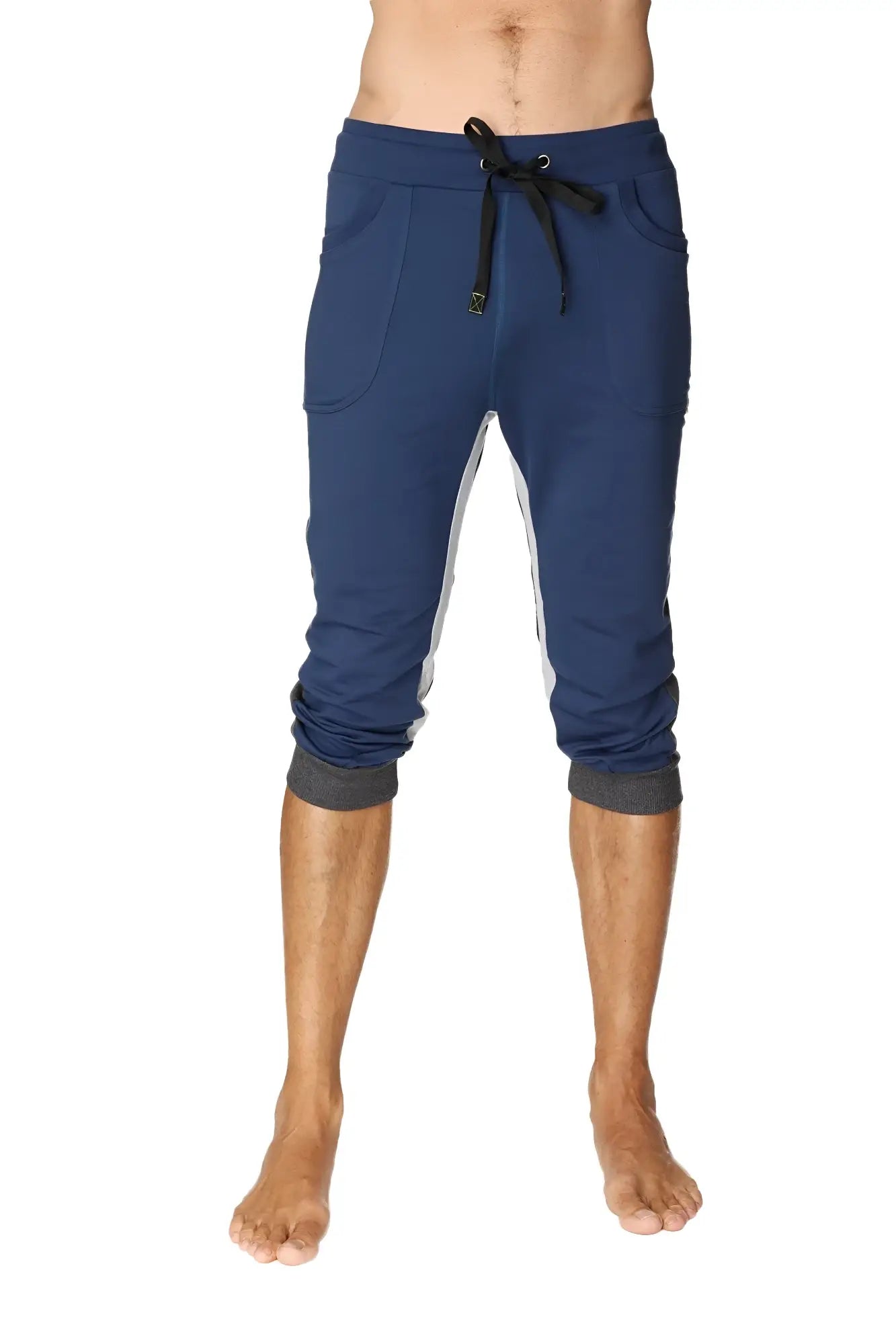 Navy blue ultra-flex tri-color cuffed yoga capri joggers with white side panels and black drawstring waistband